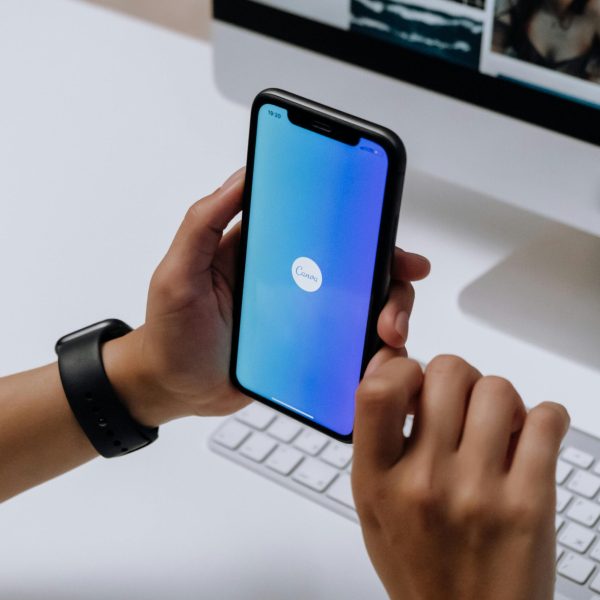 Holding a Smartphone in front of an Imac